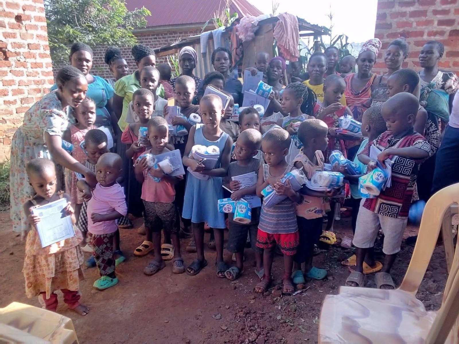 Children with sanitary aid and scholastic materials